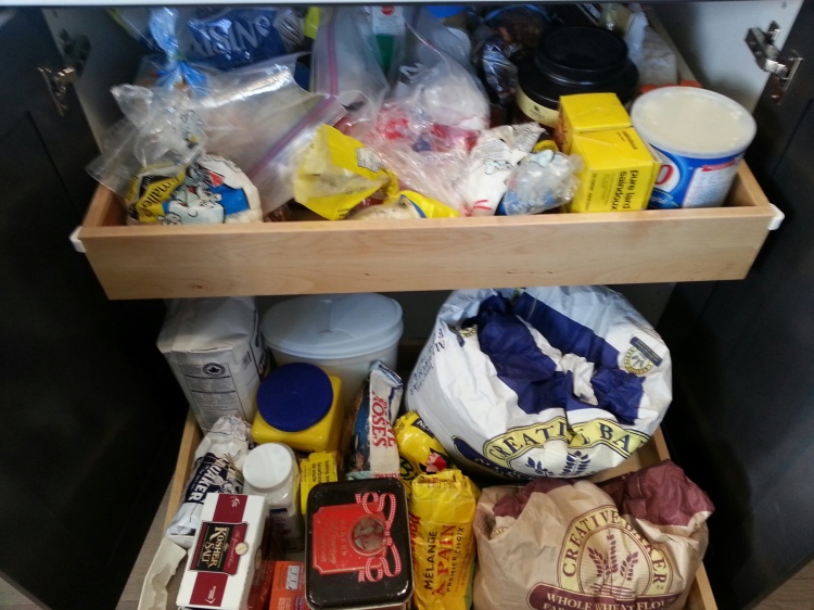 While this may look like a jumbled mess to some, to me it's nirvana.  All my baking supplies are in one area, including my 10 kg and 20 kg bags of flour.  Some day, I may go all OCD and put everything in neatly labelled plastic buckets, but for now, I'm content to have it all together.