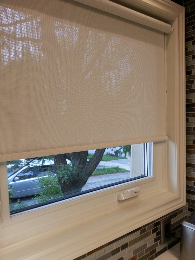 Bring on the sun! After spending the summer camped out in the basement, it's nice to see the light of day.  However, the sun really dazzles on those new white countertops, so our mesh blinds are a must.